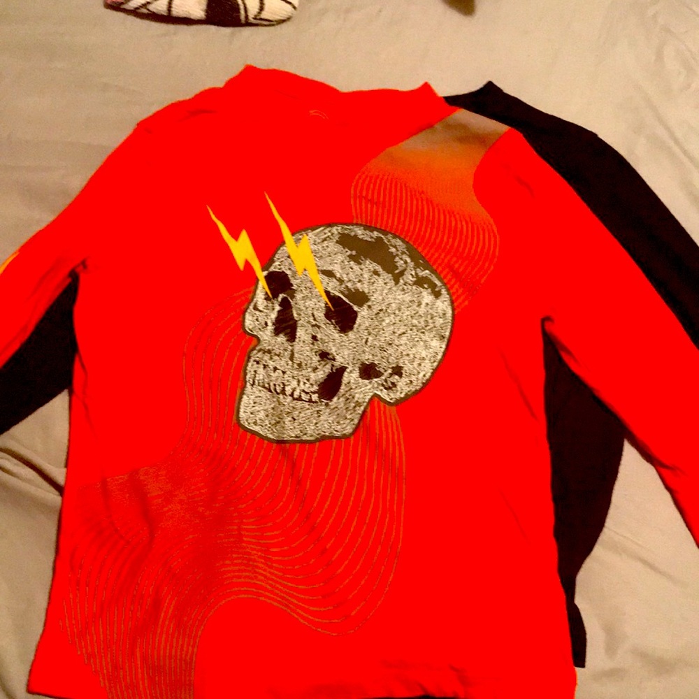 Size 8 long sleeved shirts 2 shirts ones black I t the back of the orange shirt